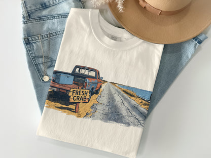 T-shirt featuring a vintage truck and "FRESH CRAB" sign on a road.