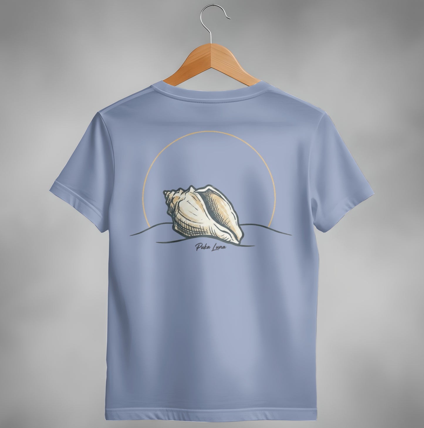 Blue t-shirt with a conch shell and "Puka Luna" text on back.