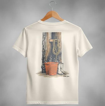 Cream t-shirt with illustration of fishing gear and boots against wooden post.