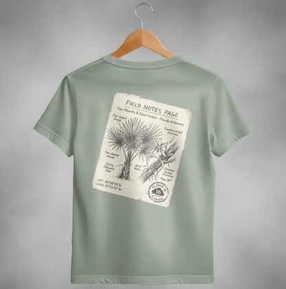 T-shirt with "Field Notes" page graphic featuring saw palmetto and ghost orchid.