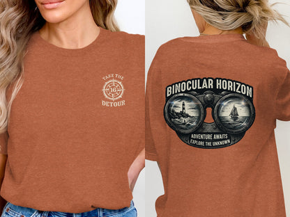 Front of rust-colored t-shirt: compass with "Take the Detour" text. Back: binoculars framing ocean scene, "Binocular Horizon" text.