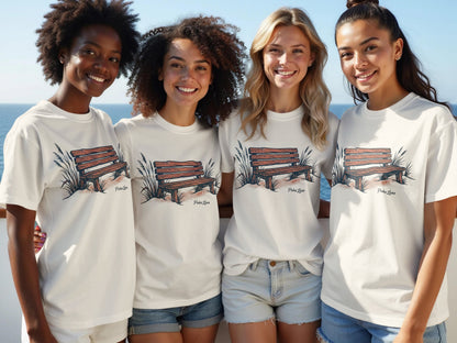 Four women wear white t-shirts with a wood bench graphic.