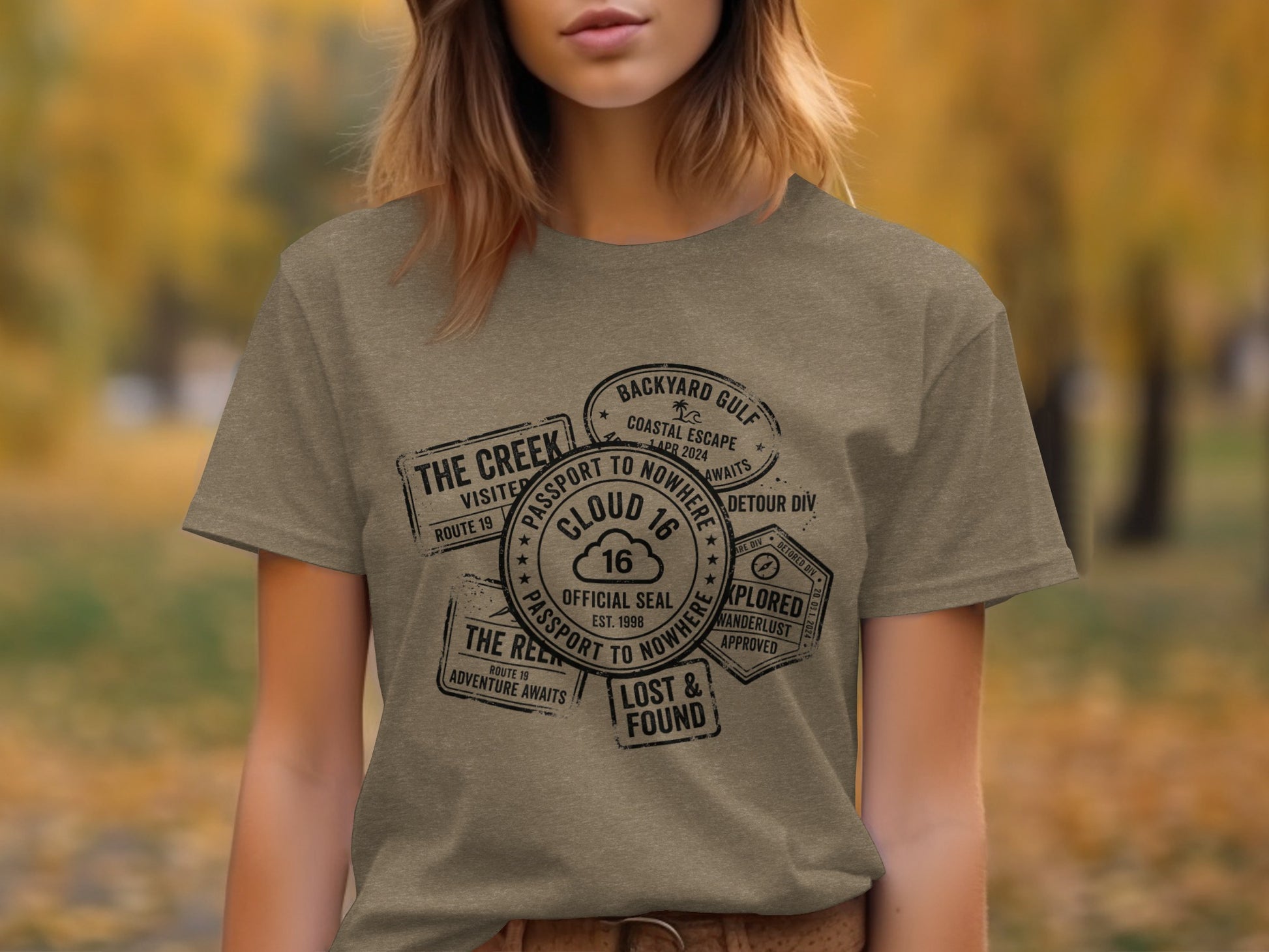 Rugged Wanderlust Passport Stamp Graphic Wilderness Shirt: T-shirt with circular passport stamps featuring "Cloud 16" and "Passport to Nowhere".