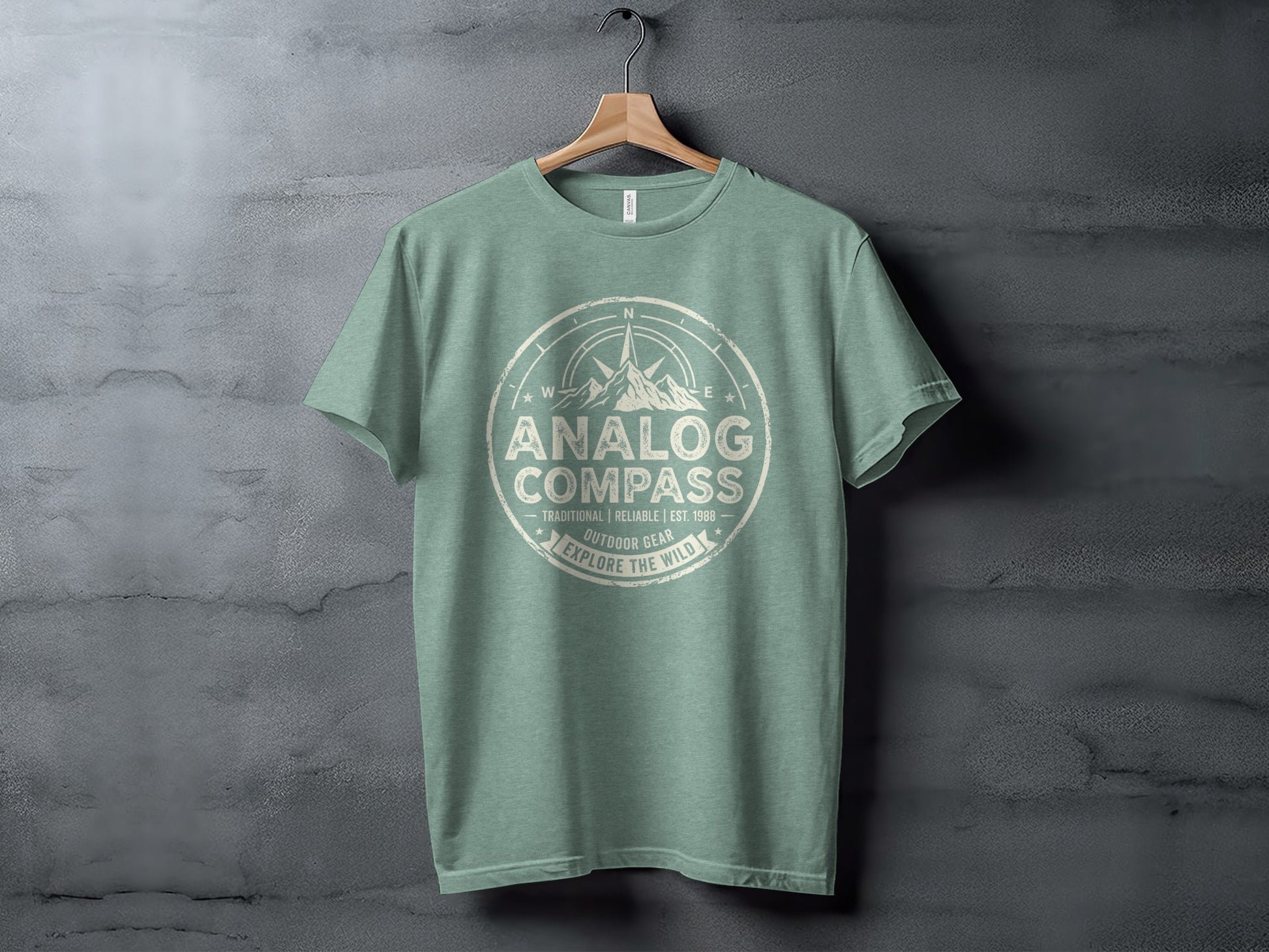 Analog Compass Heritage: The Explorer's Adventure Tee: Green t-shirt with "Analog Compass Outdoor Gear Explore the Wild" compass graphic.