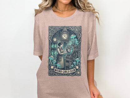 T-shirt graphic depicting a steampunk scene with mushrooms, clocks, and the text "Weird Girls Club".
