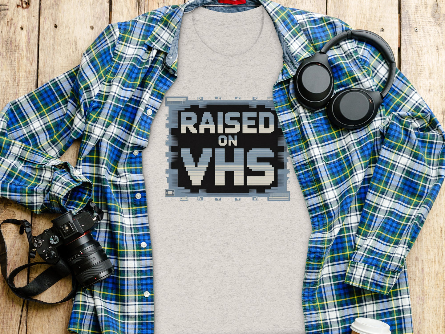 Retro 'Raised on VHS' Graphic Tee for Nostalgic Product