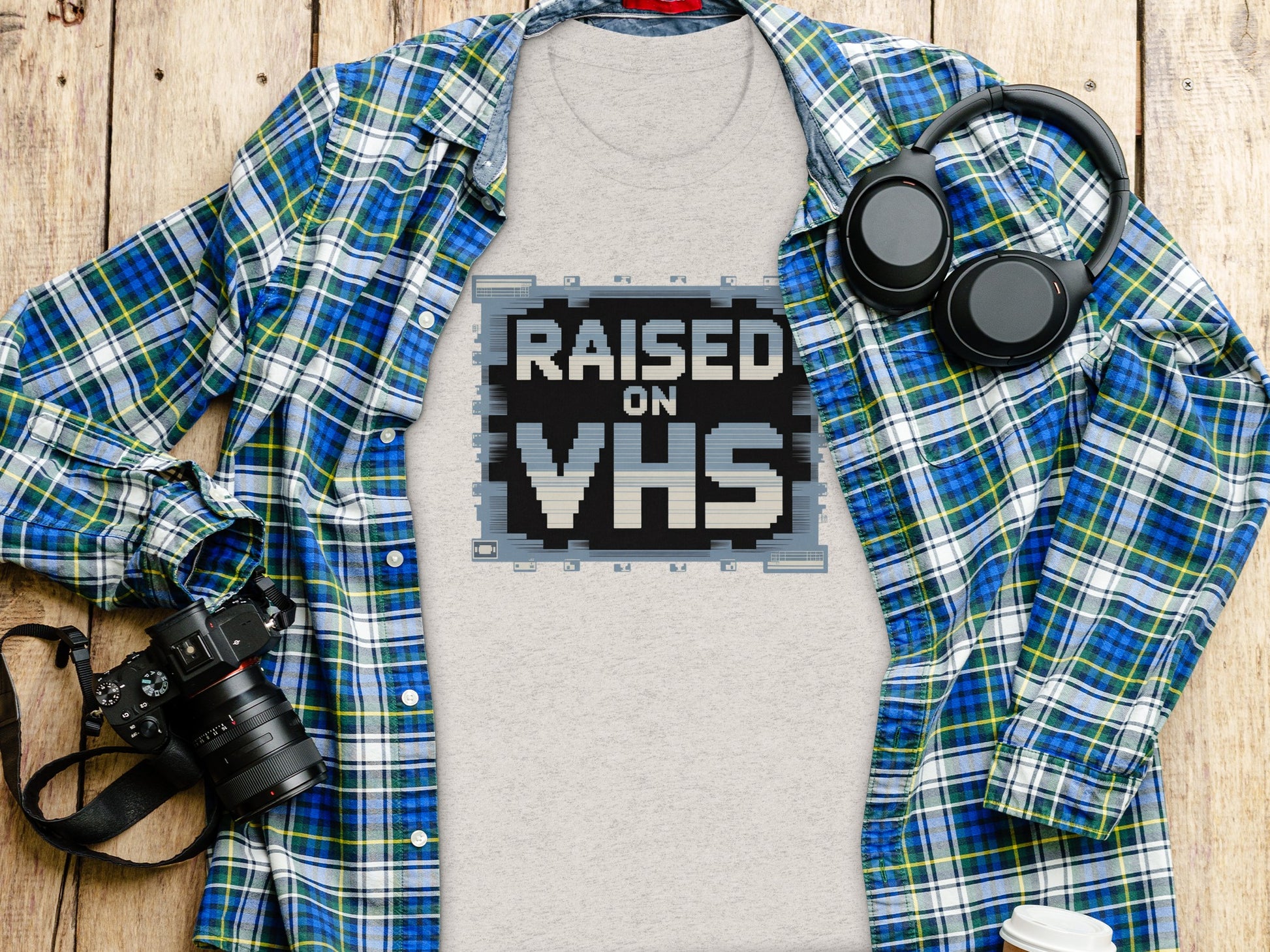 Retro 'Raised on VHS' Graphic Tee for Nostalgic Product
