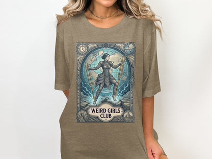 Woman in t-shirt with "Weird Girls Club" design featuring a woman with tuning forks.