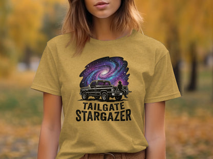 Heritage Cosmic Tailgate Stargazer Nomad Tee: Black truck under a starry galaxy on a gold t-shirt.