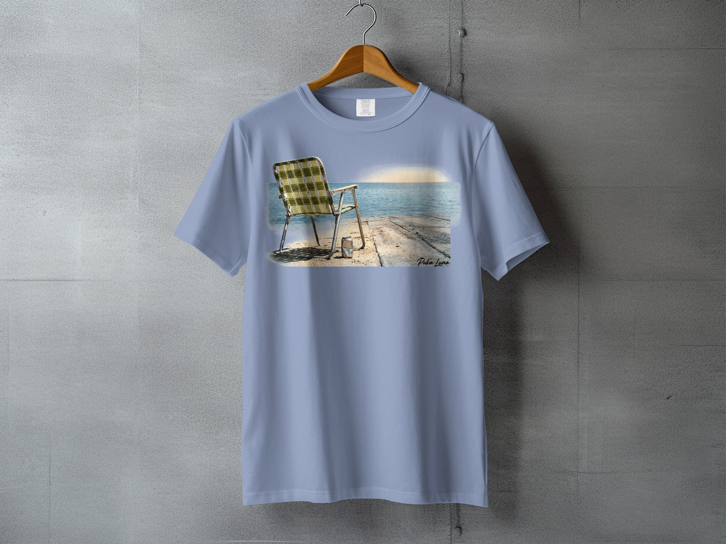 T-shirt featuring a beach chair on a pier at sunset.