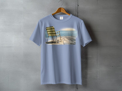 T-shirt featuring a beach chair on a pier at sunset.