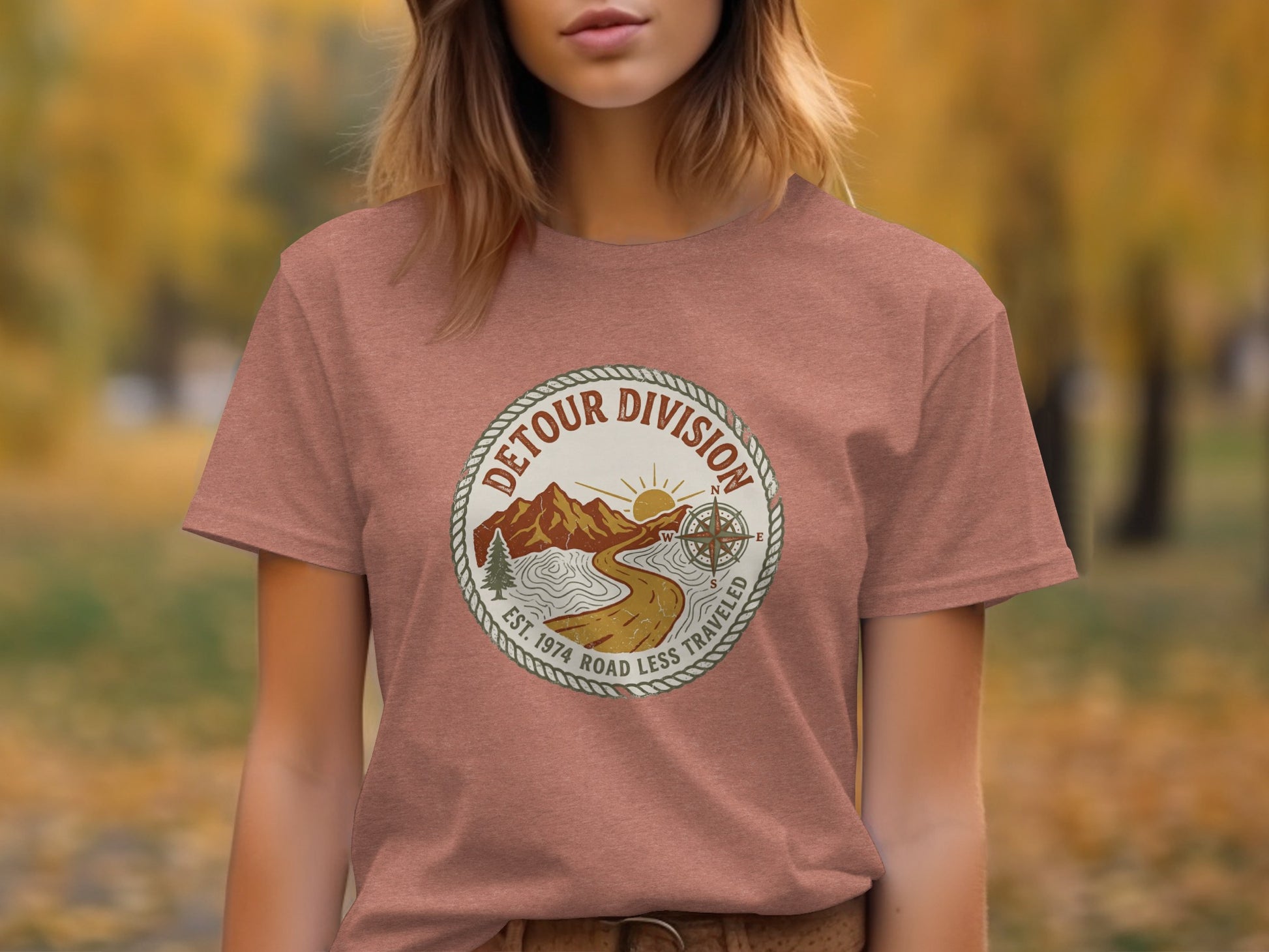 Detour Division Heritage | Vintage Outdoor Apparel: Dusty rose t-shirt with "Detour Division" circular logo and compass.