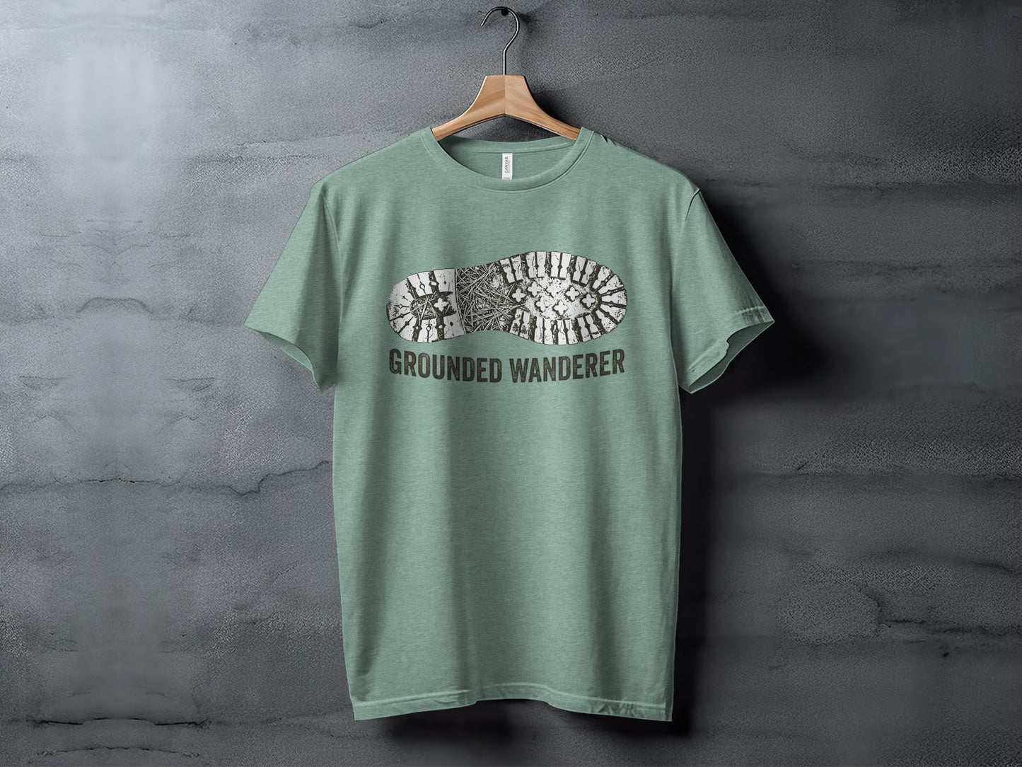 Grounded Wanderer Boot Print | Vintage Outdoor Apparel: T-shirt with a boot print graphic and "GROUNDED WANDERER" text.