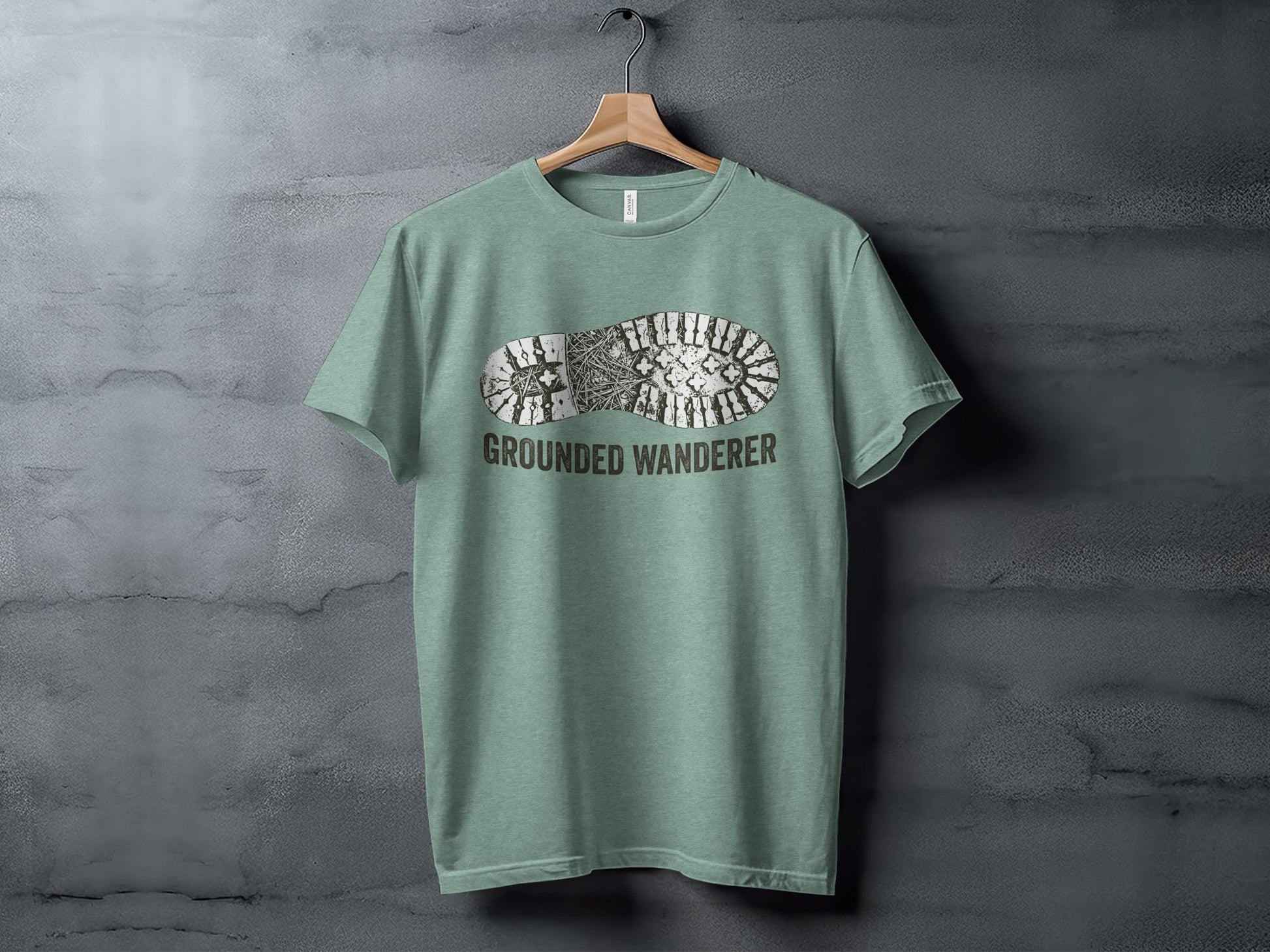 Grounded Wanderer Boot Print | Vintage Outdoor Apparel: T-shirt with a boot print graphic and "GROUNDED WANDERER" text.