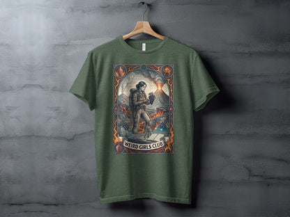 T-shirt with illustration of a woman near a volcano, holding fruit, text "Weird Girls Club."
