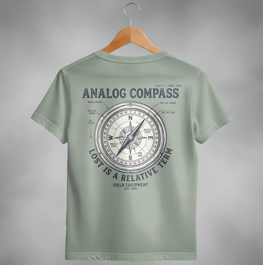 Olive green t-shirt with a vintage analog compass design, "Lost is a relative term."