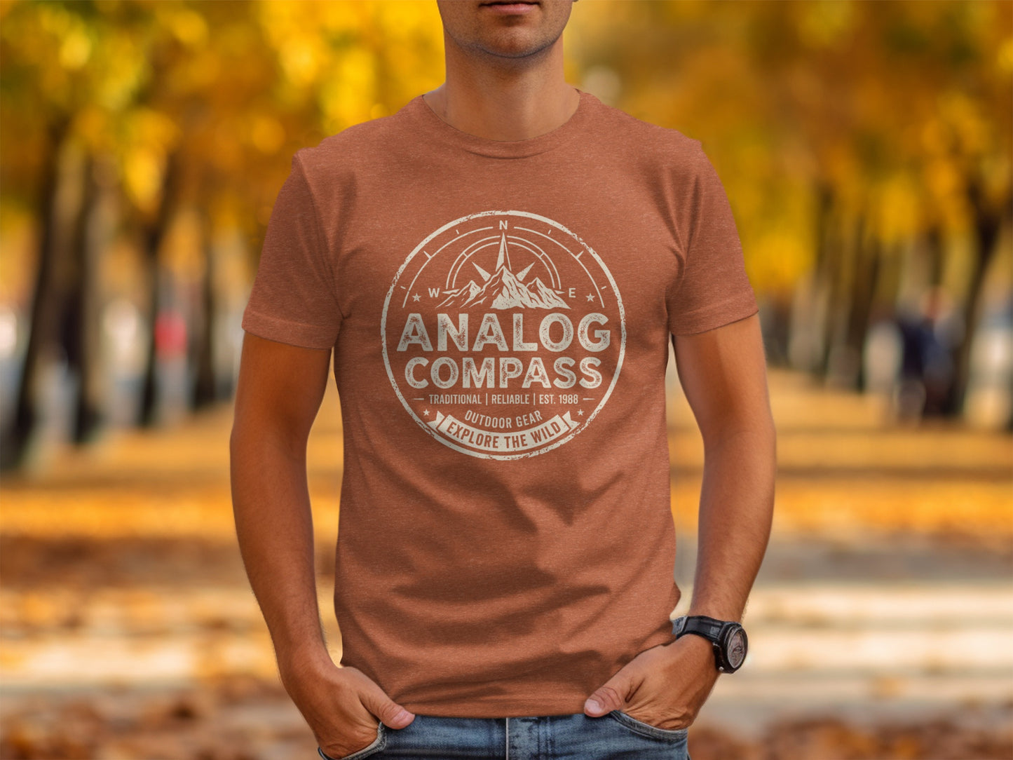 Analog Compass Heritage: The Explorer's Adventure Tee: Brown t-shirt with "Analog Compass" compass logo and "Outdoor Gear" text.