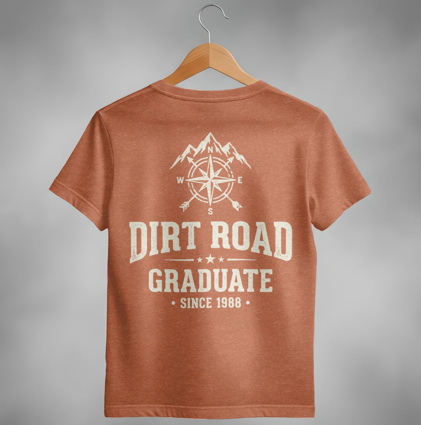 Orange t-shirt with "Dirt Road Graduate Since 1988" and compass graphic.