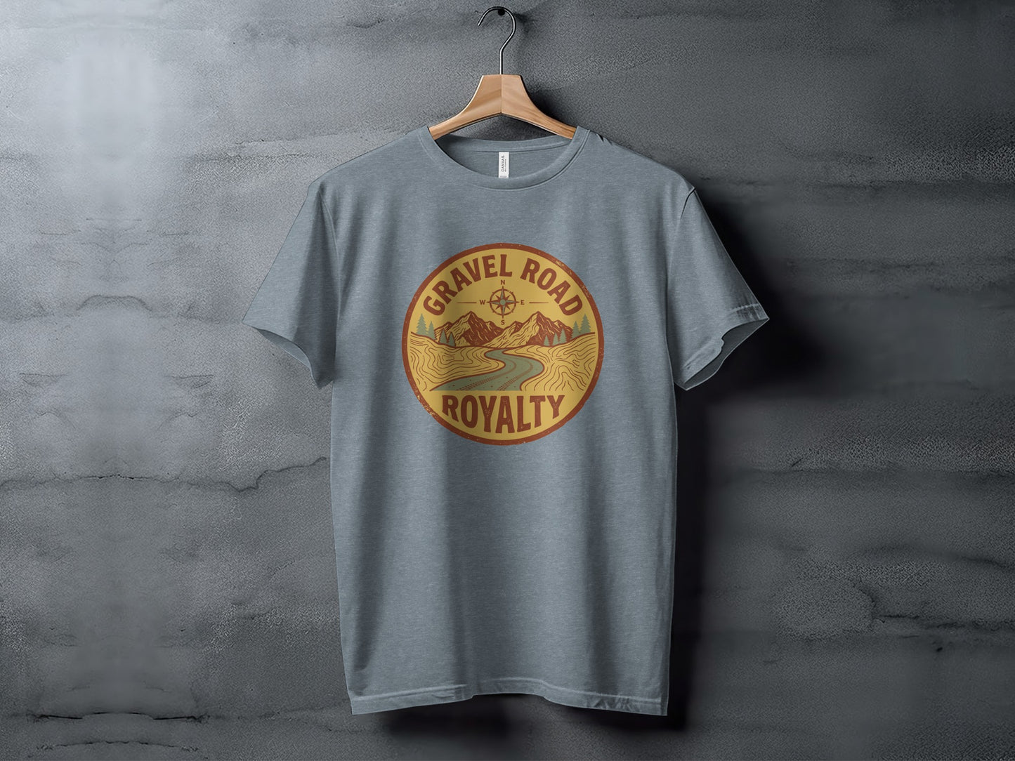 Gravel Road Royalty Adventure Tee | Vintage Outdoor Apparel: Grey t-shirt with circular "Gravel Road Royalty" logo featuring a mountain road.