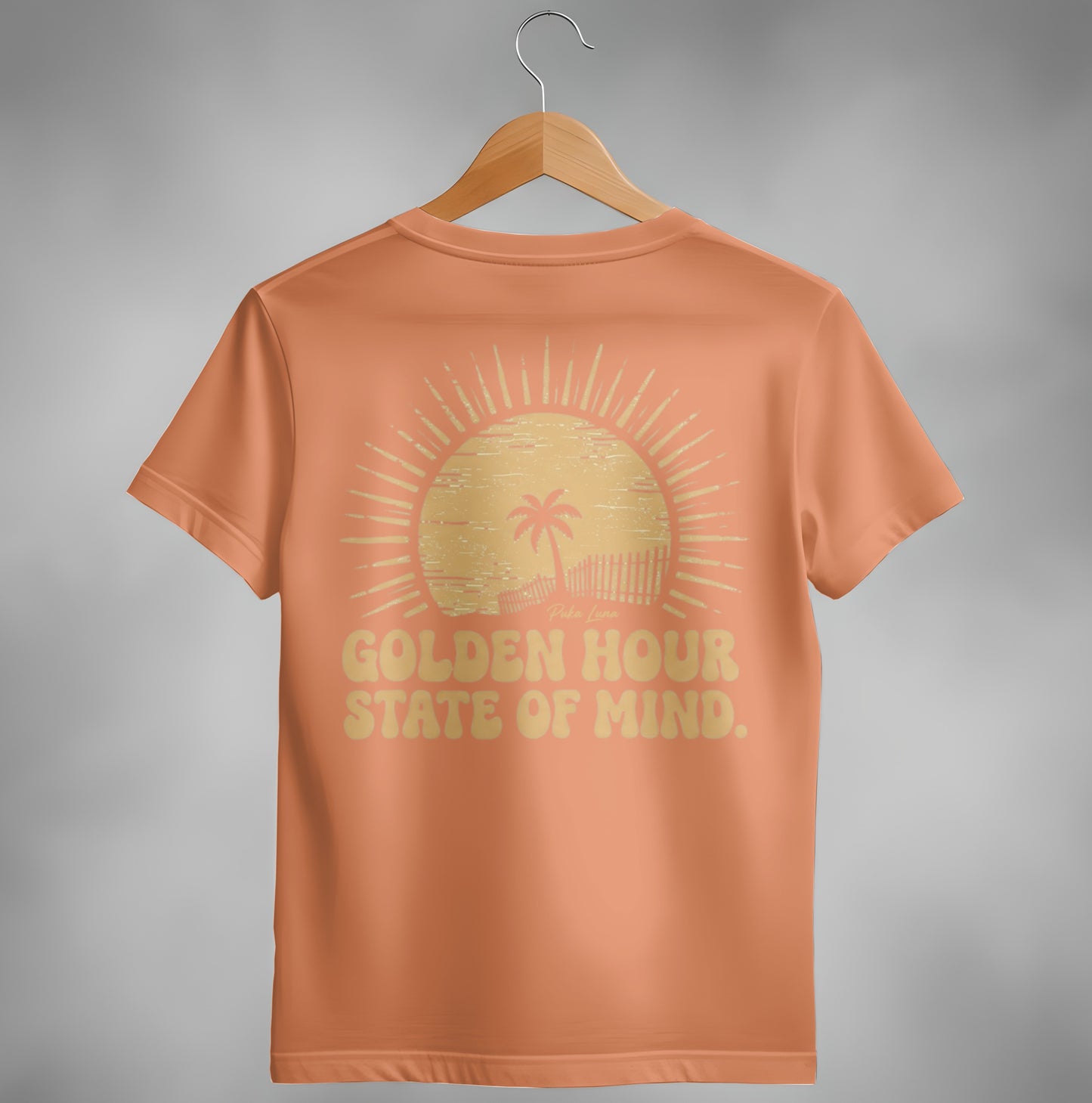 Orange t-shirt with "Golden Hour State of Mind" text and sun graphic.