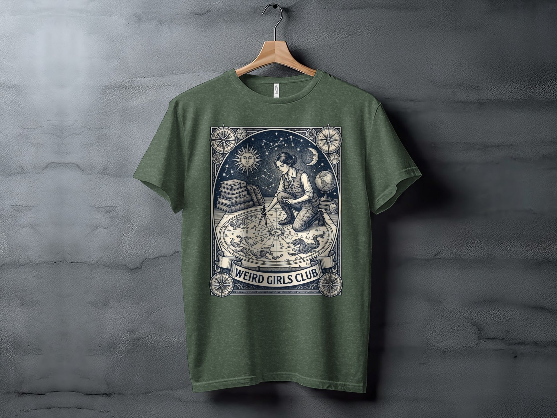 T-shirt with celestial map and kneeling woman, "Weird Girls Club" text.