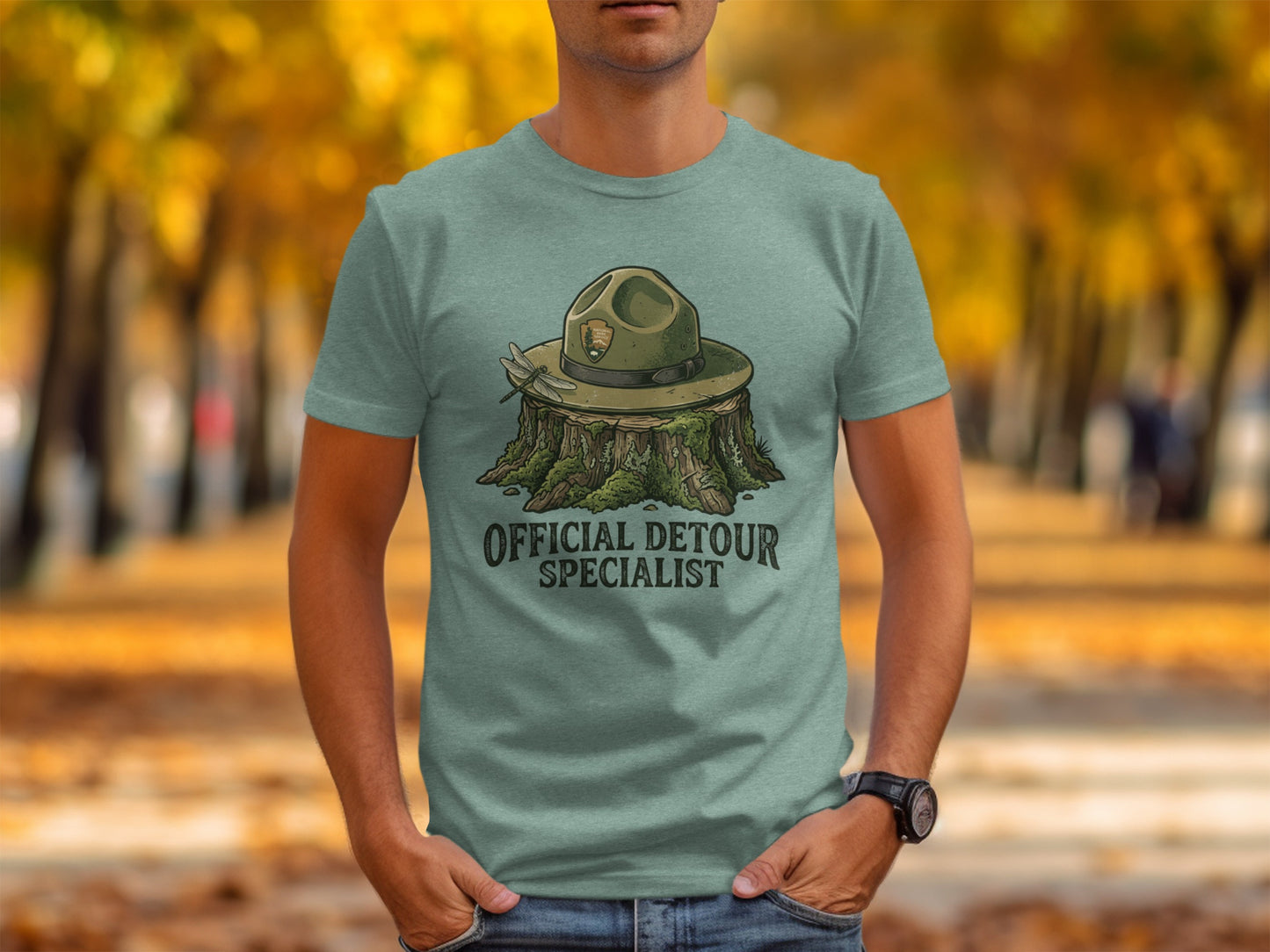 Official Detour Specialist Heritage | Vintage Outdoor Apparel: Green t-shirt with ranger hat and text "OFFICIAL DETOUR SPECIALIST".