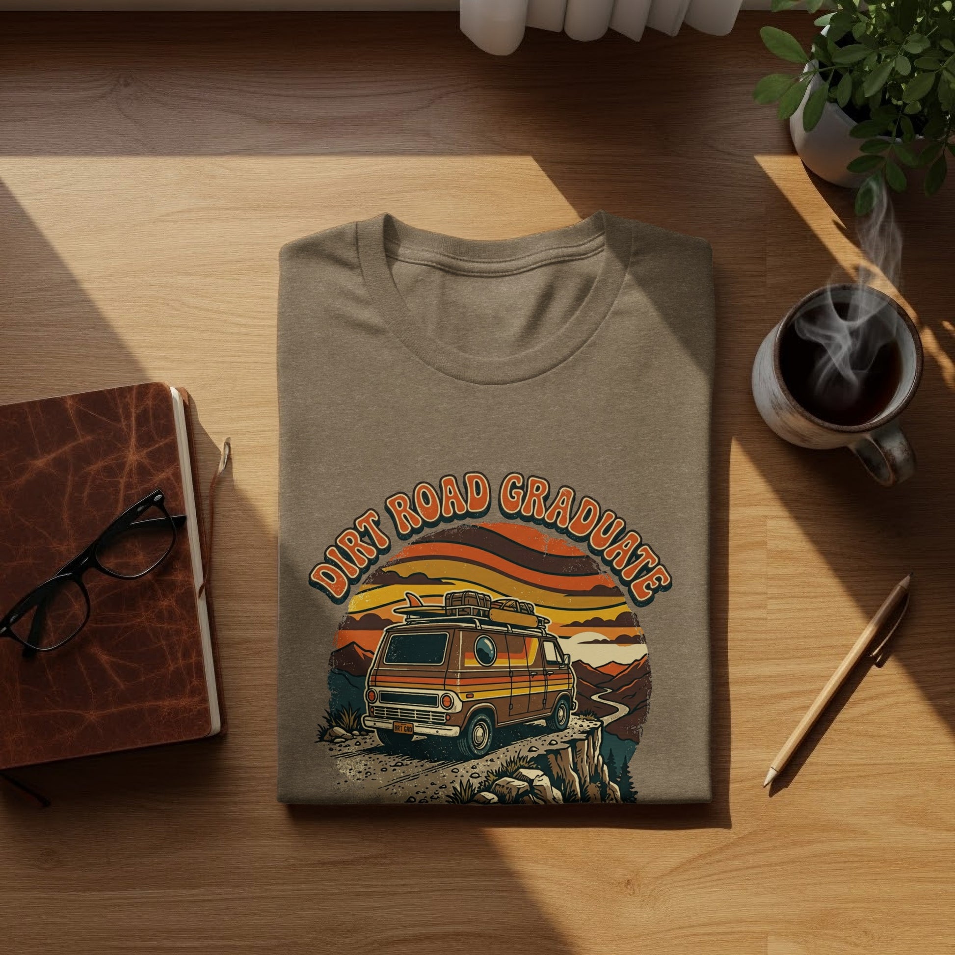 Heritage Dirt Road Graduate Adventure Tee Nomad Tee: T-shirt with "Dirt Road Graduate" text, van, and sunset landscape.