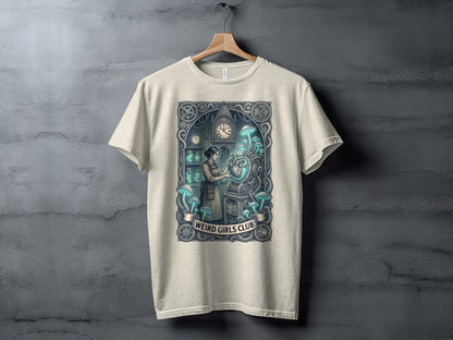 T-shirt graphic of a woman with glowing mushrooms next to a steampunk machine, with "Weird Girls Club" text.