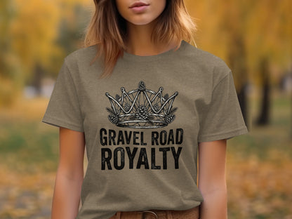 Gravel Road Royalty: Backcountry Outpost Shirt: Brown t-shirt with a crown graphic made of bicycle gears and pinecones, text reads "GRAVEL ROAD ROYALTY".
