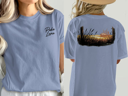 Light blue t-shirt with Puka Luna logo and boat scene graphic.