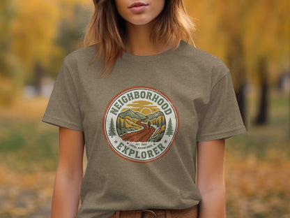 The Original Neighborhood Explorer Adventure Adventure Top: Circular logo on a brown t-shirt depicts a mountain landscape with text.