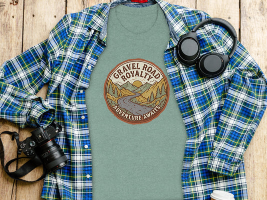 Gravel Road Royalty Vintage Adventure Tee: Backcountry Outpost Shirt: Green t-shirt with "Gravel Road Royalty Adventure Awaits" text and mountain graphic.