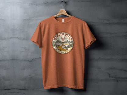 The Original Wander Often Vintage Explorer Adventure Top: Orange t-shirt with circular "Wander Often Explore the Unknown" graphic of mountains and compass.
