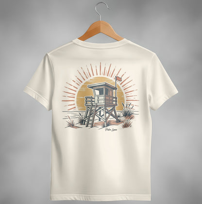 Cream t-shirt with vintage lifeguard tower and sun graphic.