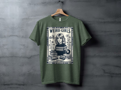 T-shirt with "Weird Girls Club" text and retro graphic of books, cassette, and billiard ball.