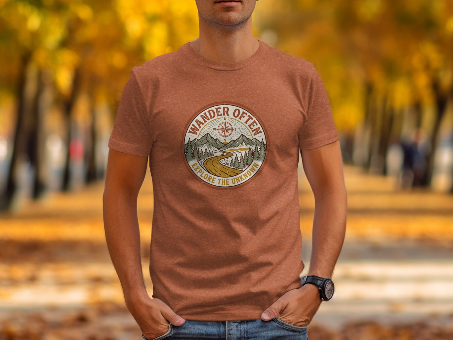 The Original Wander Often Vintage Explorer Adventure Top: Brown t-shirt with circular graphic "Wander Often, Explore the Unknown" on a man.