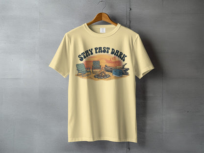 Light yellow t-shirt with "Stay Past Dark" text over camping scene.