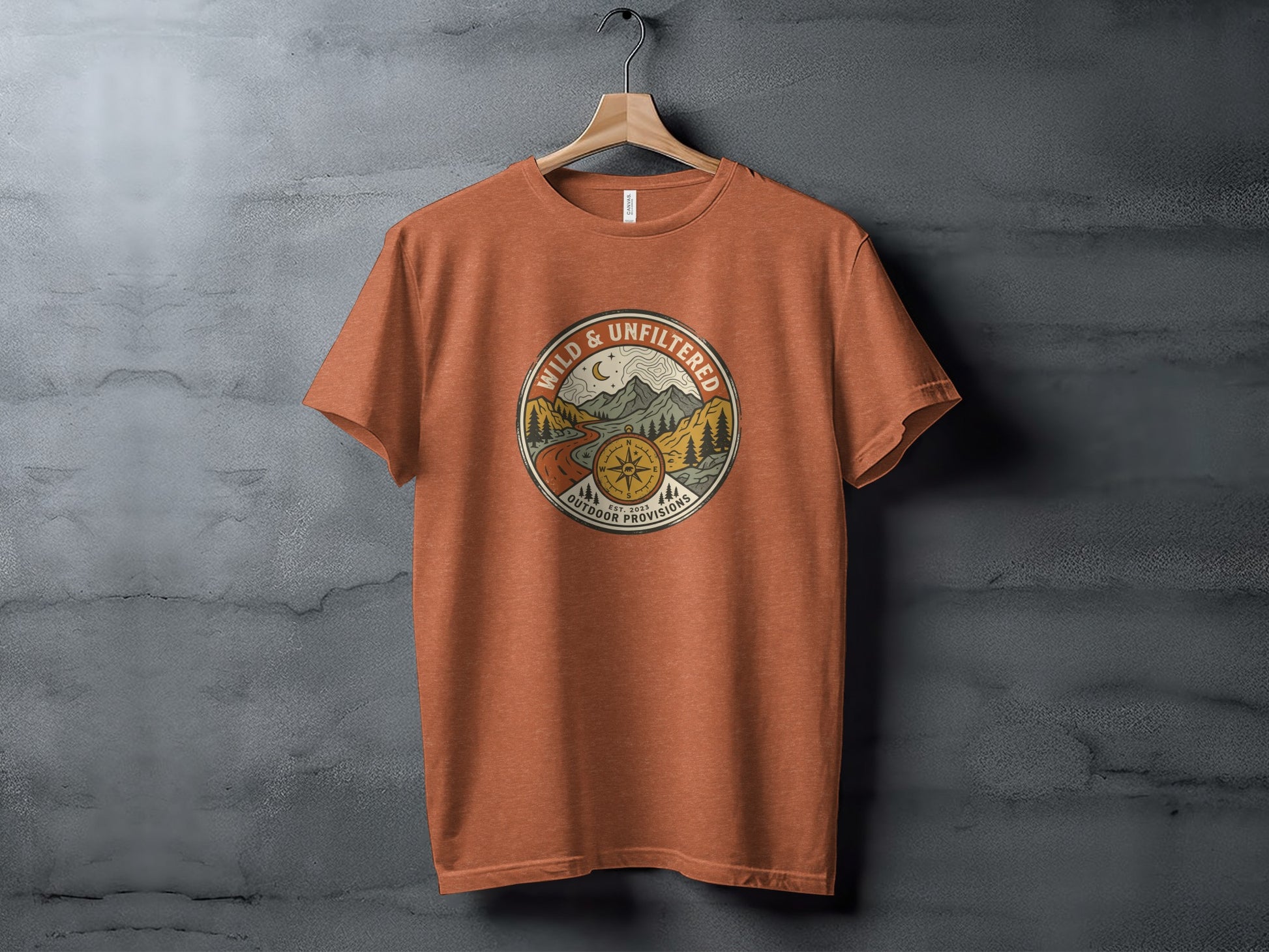 Rugged Wild & Unfiltered Explorer Wilderness Shirt: Orange t-shirt with circular "Wild & Unfiltered" logo featuring a compass and mountain scene.