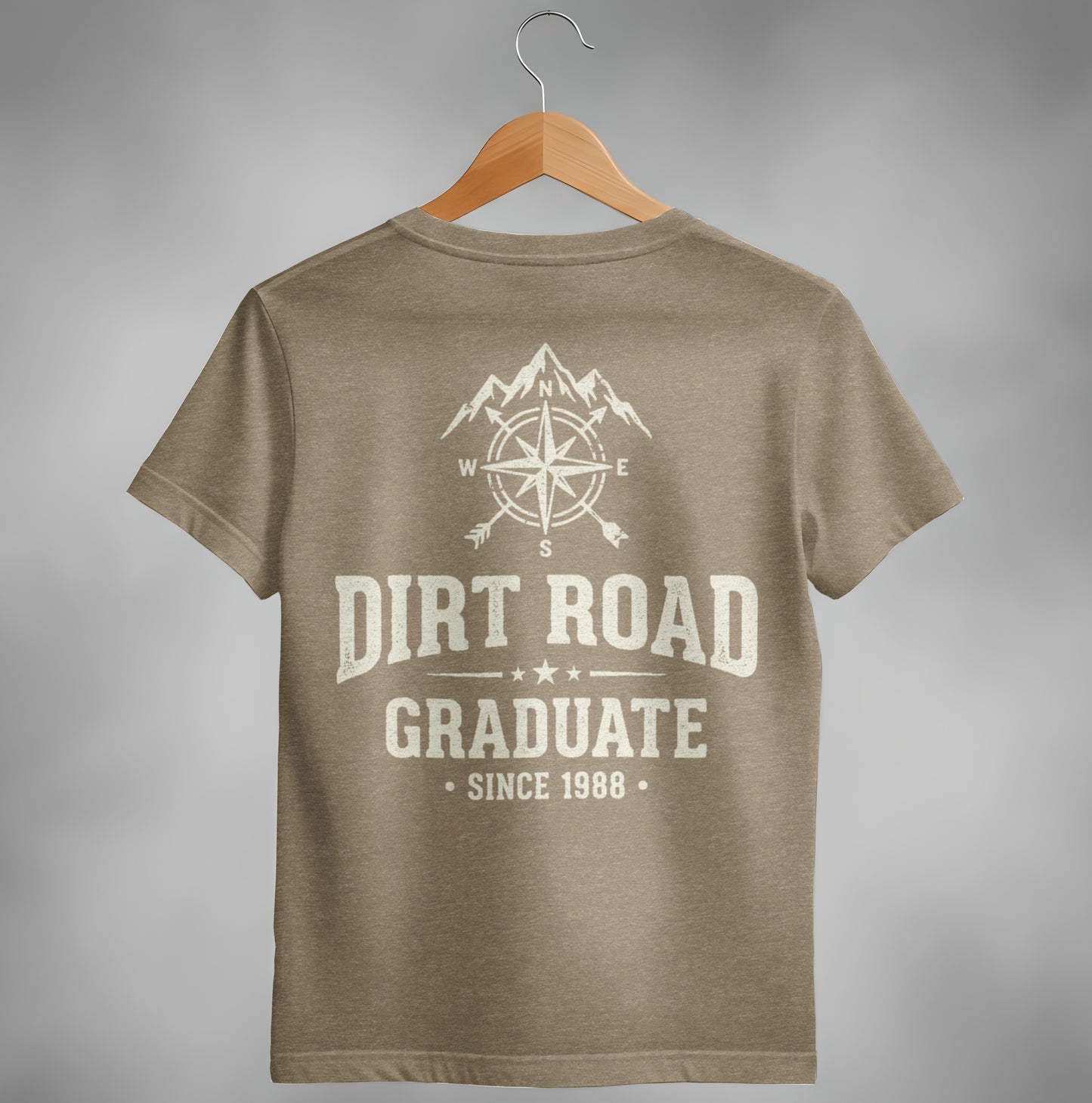 Tan t-shirt with compass and mountains graphic, "Dirt Road Graduate Since 1988".
