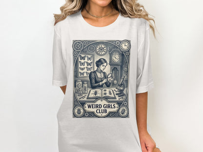 T-shirt graphic of a woman studying butterflies and clocks, with "Weird Girls Club" text.