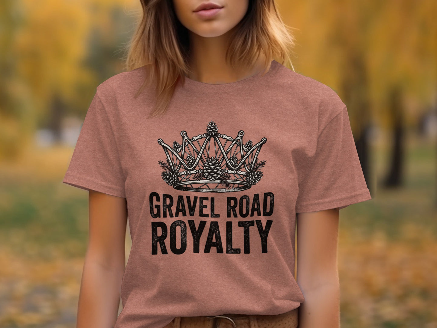 Gravel Road Royalty: Backcountry Outpost Shirt: T-shirt with "Gravel Road Royalty" text and a crown made of bike chain and pinecones.