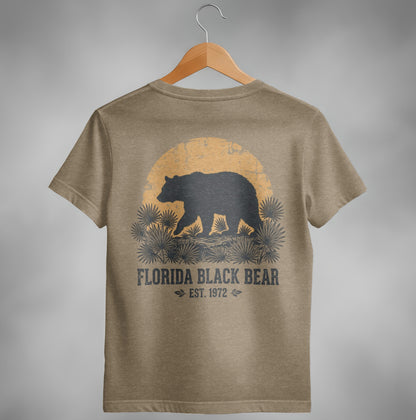 Brown t-shirt with a black bear silhouette against a sunset and palm fronds.