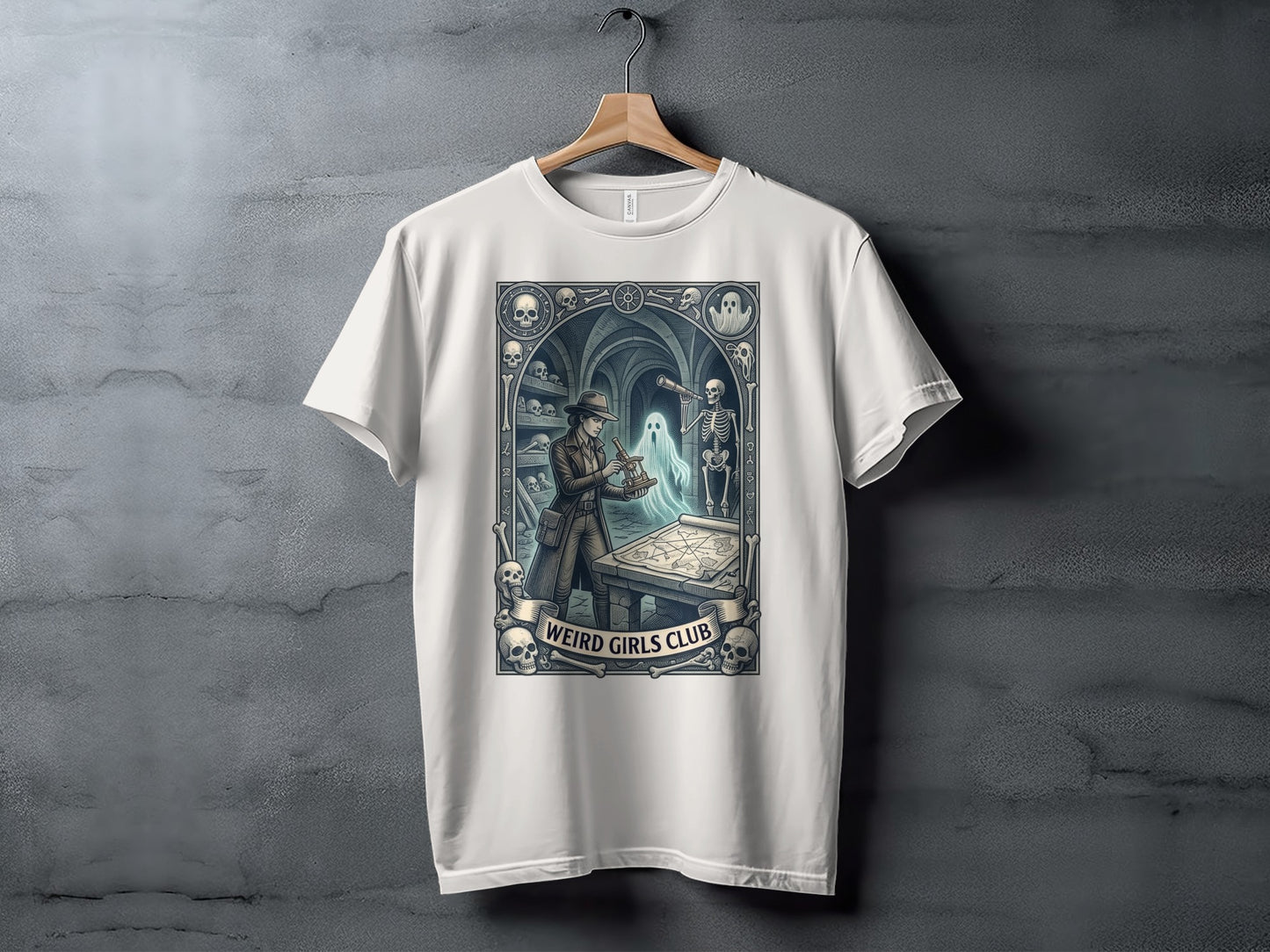White t-shirt with "Weird Girls Club" text and a gothic-themed illustration.