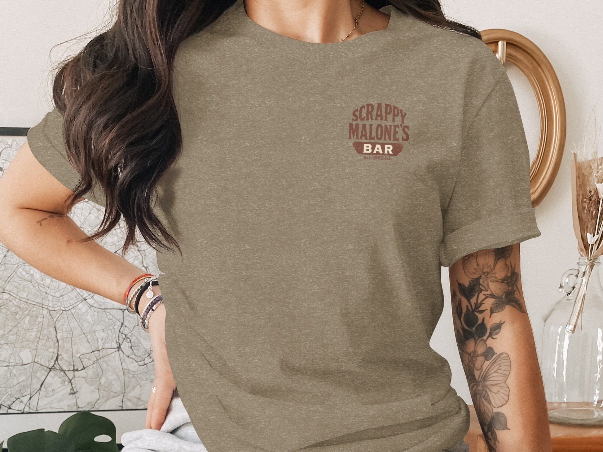 T-shirt with "Scrappy Malone's Bar" logo.