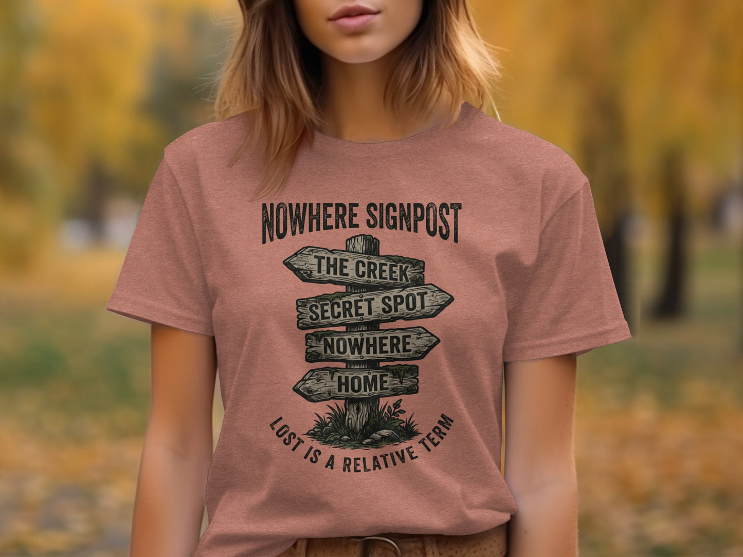 Nowhere Signpost Adventure: Backcountry Outpost Shirt: T-shirt with a wooden signpost reading "Nowhere", "The Creek", "Secret Spot", "Nowhere", "Home" with "Lost is a relative term" below.