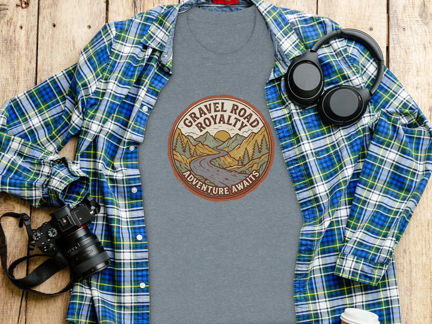 Gravel Road Royalty Vintage Adventure Tee: Backcountry Outpost Shirt: Grey t-shirt with "Gravel Road Royalty Adventure Awaits" graphic, worn open over plaid shirt.