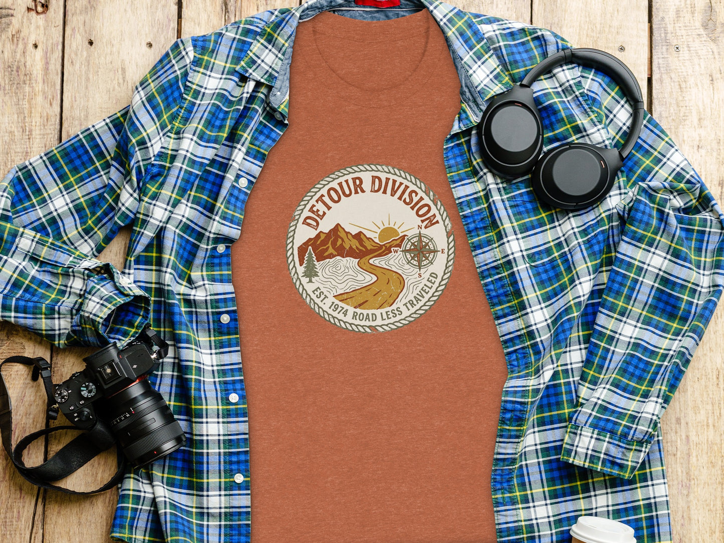 Detour Division Heritage | Vintage Outdoor Apparel: Flannel shirt and t-shirt with compass design featuring "Detour Division" text.