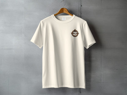 Cream t-shirt with circular logo on the left chest.