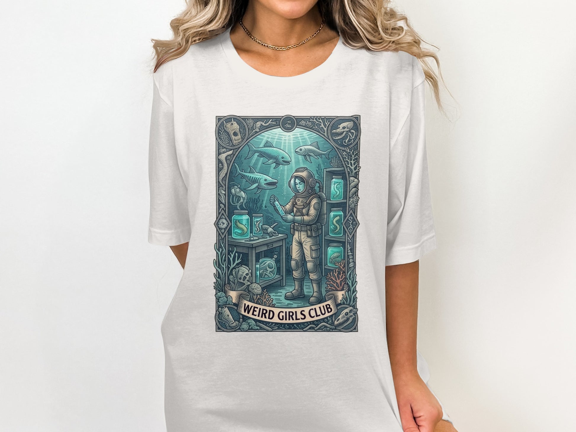 Astronaut in aquarium with sharks and marine life, "Weird Girls Club" text.