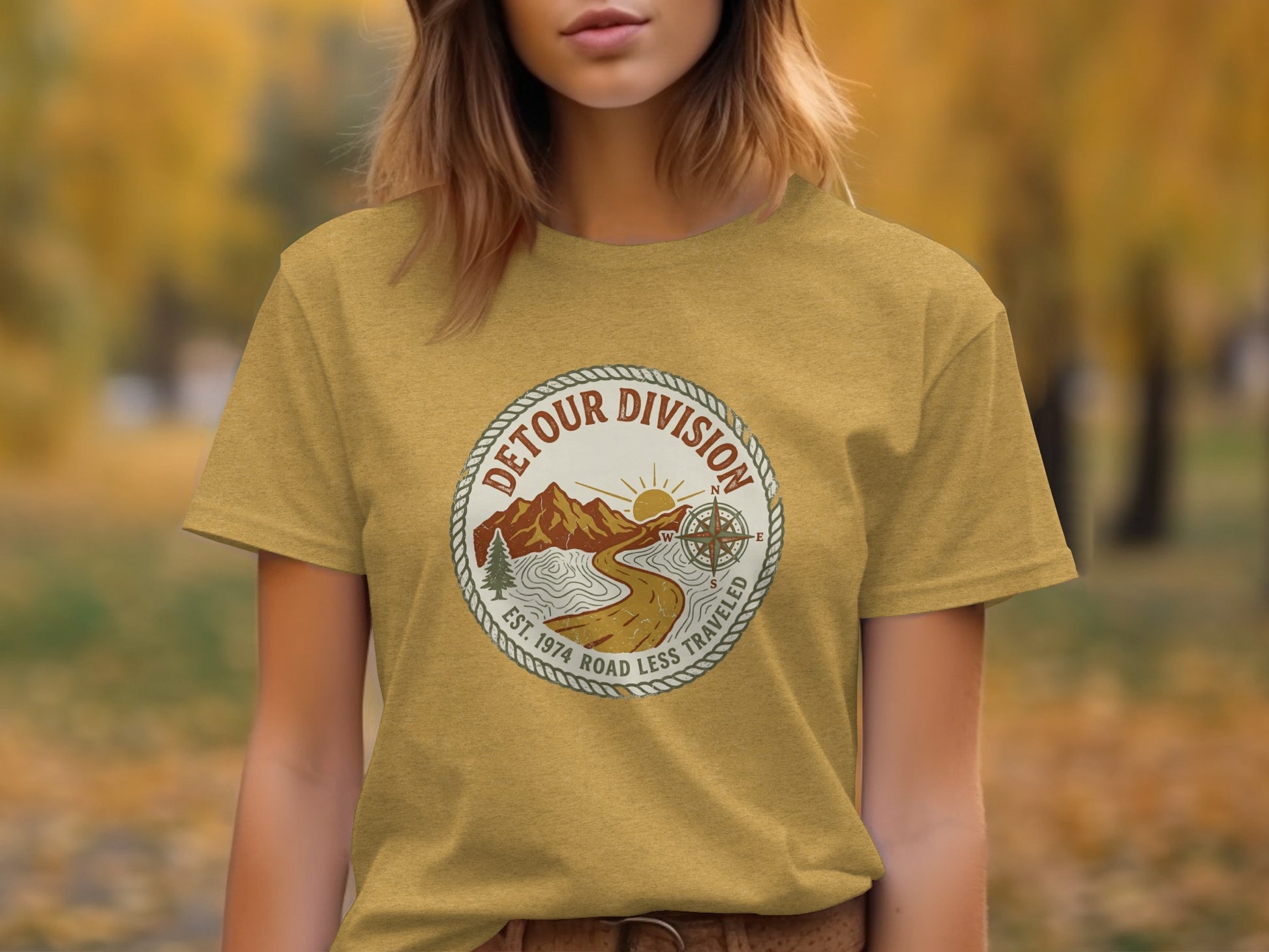 Detour Division Heritage | Vintage Outdoor Apparel: Yellow t-shirt with circular logo: "Detour Division, Est. 1974, Road Less Traveled."